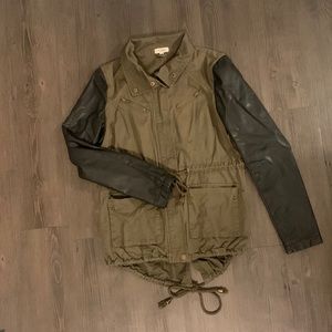 Army green jacket with black leather sleeves
